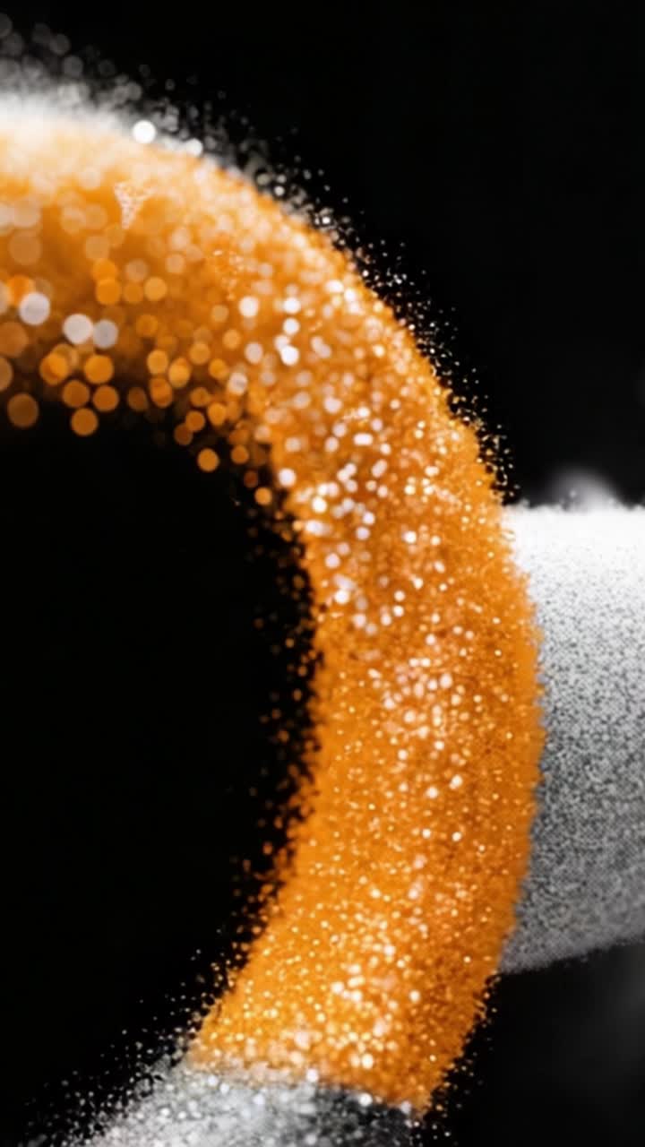 Una visualizzazione ipnotica di particelle colorate che vorticano in un motivo dinamico su uno sfondo scuro, che mostra la bellezza del movimento e del colore nel design astratto.