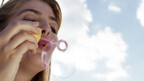 beautiful woman blowing bubbles outdoors sunshine freedom blue sky is pretty