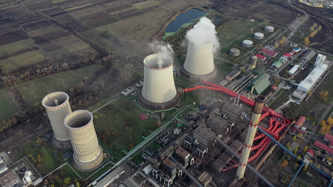 Aerial View of a Large Power Plant with Cooling Towers