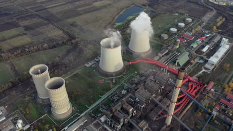aerial view of a large power plant with cooling towers