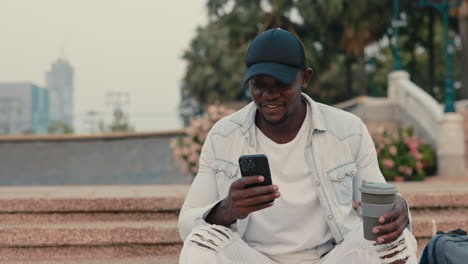 man using phone in park