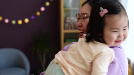 Asian-mother-holding-her-baby