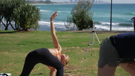 Yoga Instructor Doing The Preparation To Reversed Triangle Pose In Burleigh Hill - Queensland, Australia - full slowmo shot