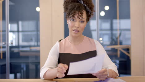 african american business woman reading documents with copy space