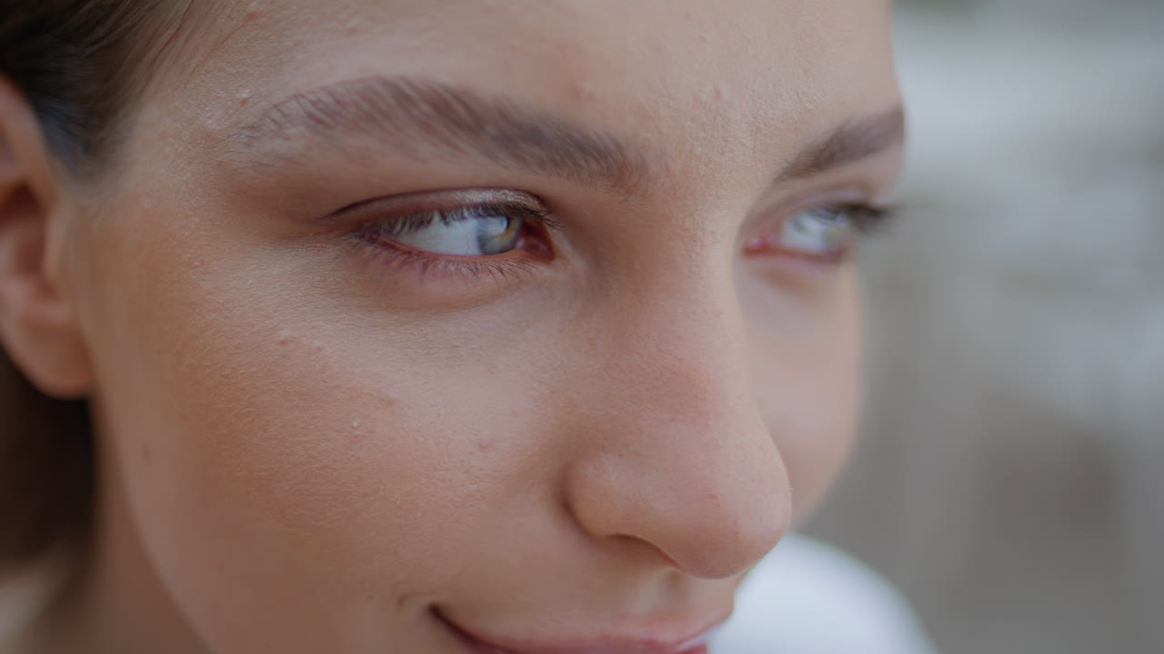 Closeup woman eyes looking camera with serene expression portrait