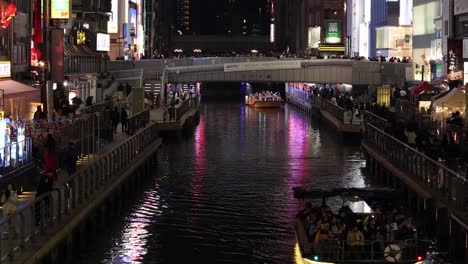 boat tour along a brightly lit city canal