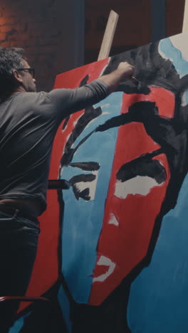 artist painting an abstract portrait