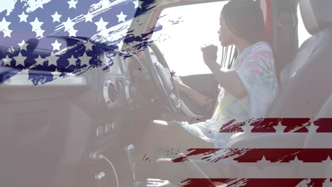 animation of flag of usa over african american woman in car on beach
