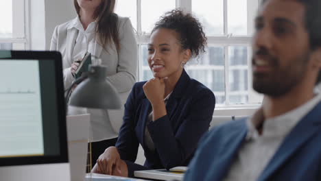 mixed race business woman sharing ideas in office meeting corporate team brainstorming ideas for project in boardroom