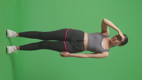 woman with headache after workout on green screen