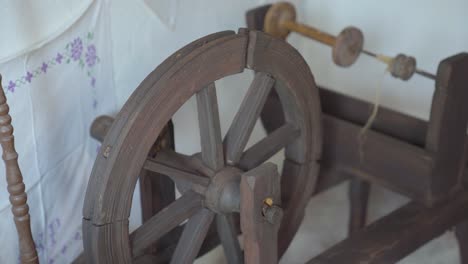 old, vintage, antique spinning wheel in corner of old house