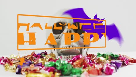 animation of happy halloween text over skull and sweets