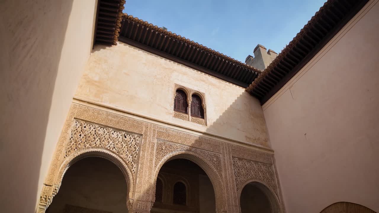 Panoramic shot of the Patio of the Golden Room inside the monumental complex of the Alhambra in Granada, Spain