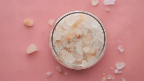 Close-up-of-pink-rock-salt-in-a-bowl-on-table