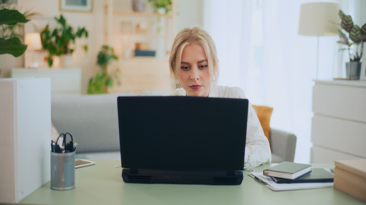 Concentrated Confident Girl Working on Laptop
