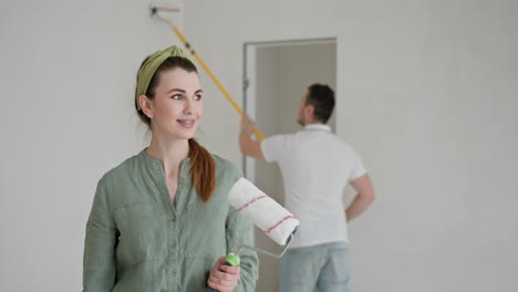 couple painting a room