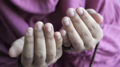 close up of of muslim women hands praying