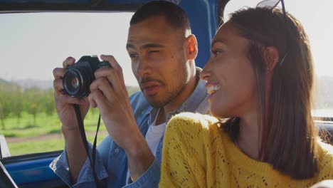 Young-couple-on-a-road-trip-in-their-pick-up-truck