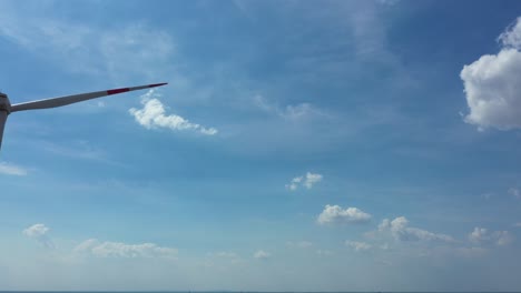 windmill, large wind power turbines spinning to generating clean renewable energy for sustainable development