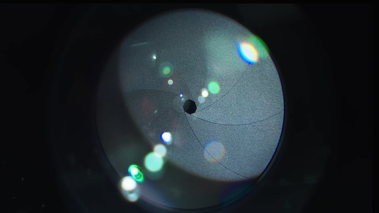 Macro Of Camera Lens Opening And Closing Its Aperture.