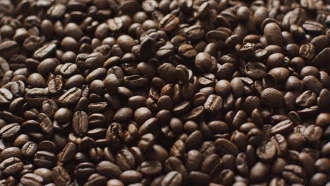 Video-of-close-up-of-pile-of-close-up-roasted-brown-coffee-beans