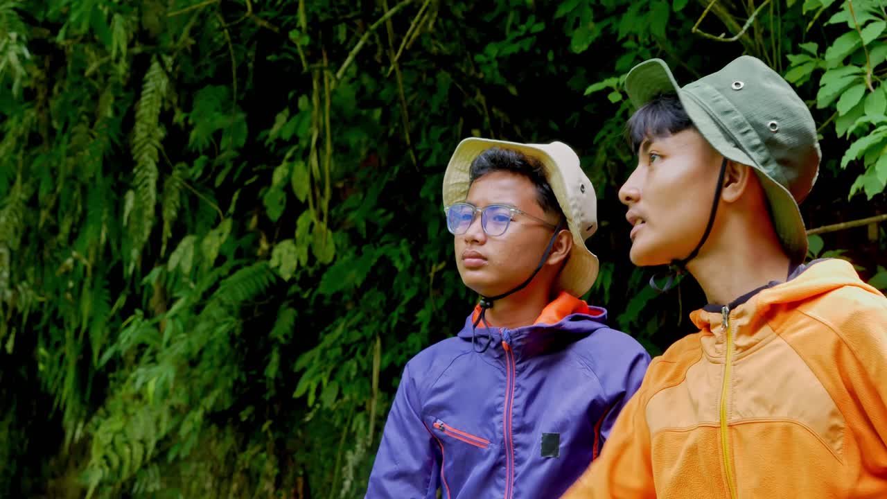 Two friends hiking together exploring nature's beauty with adventure and excitement