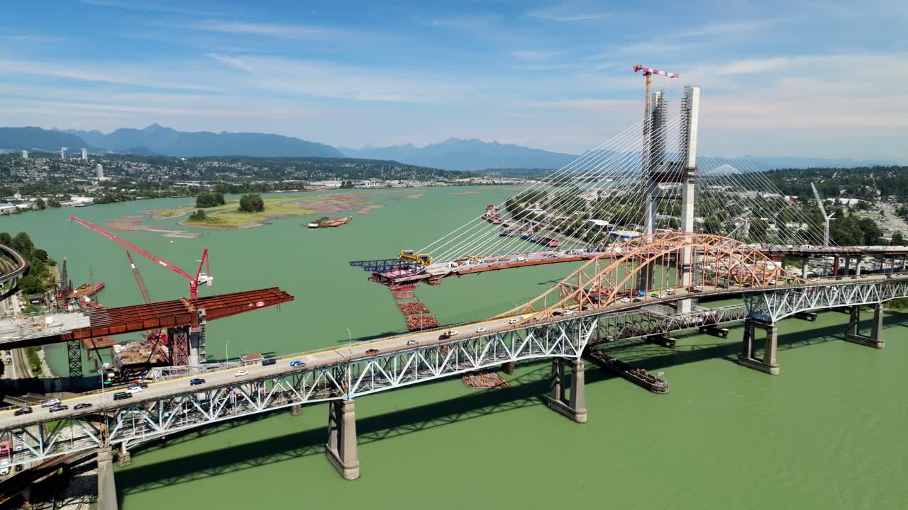 Pattullo Bridge And Pattullo Bridge Replacement Over Fraser River Between New Westminster and Surrey Cities In Canada. - aerial shot