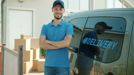 delivery man in front of delivery van