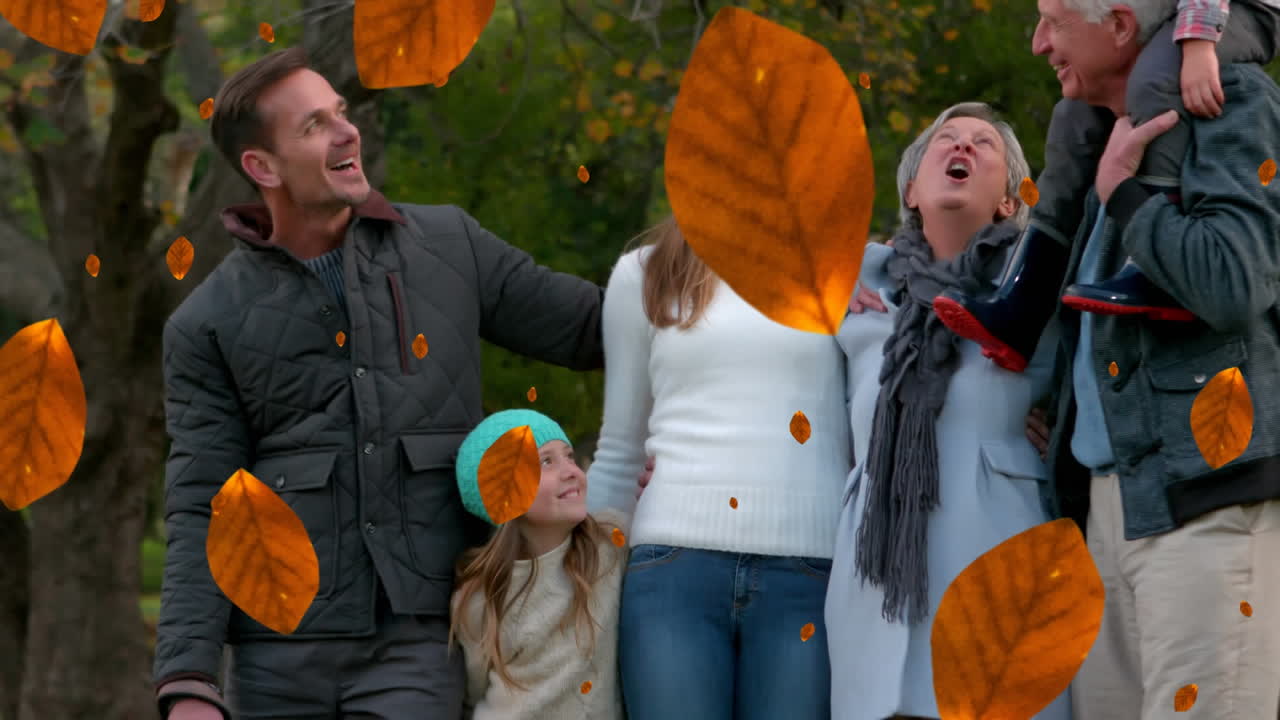 공원에서 행복한 백인 가족 위에 떨어지는 가을 잎의 애니메이션