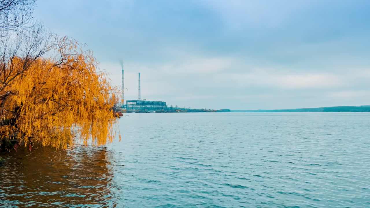 Autumnal River Scene with Power Plant