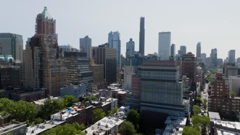 downtown brooklyn city from dumbo, sunny, summer day in new york - descending, drone shot