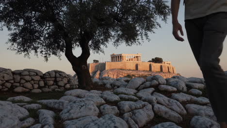 acropolis in athens at sunset with tourist
