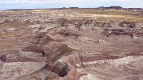 drone shot over a dusty badland in arizona