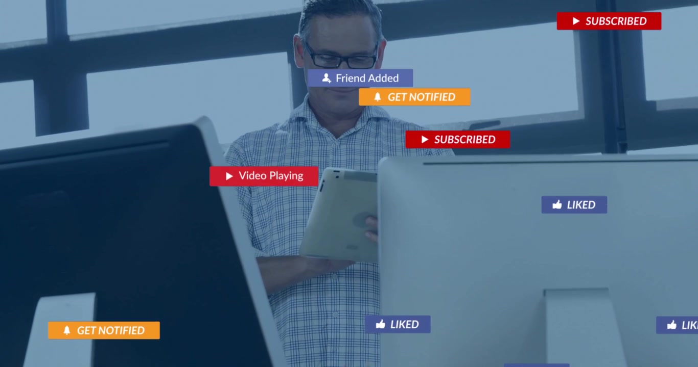 Man swiping tablet after send message notification appears, monitoring social media overlays