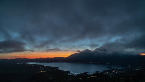 sunrise over a volcano and lake