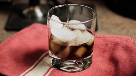 Iced-Coffee-being-poured,-Close-up