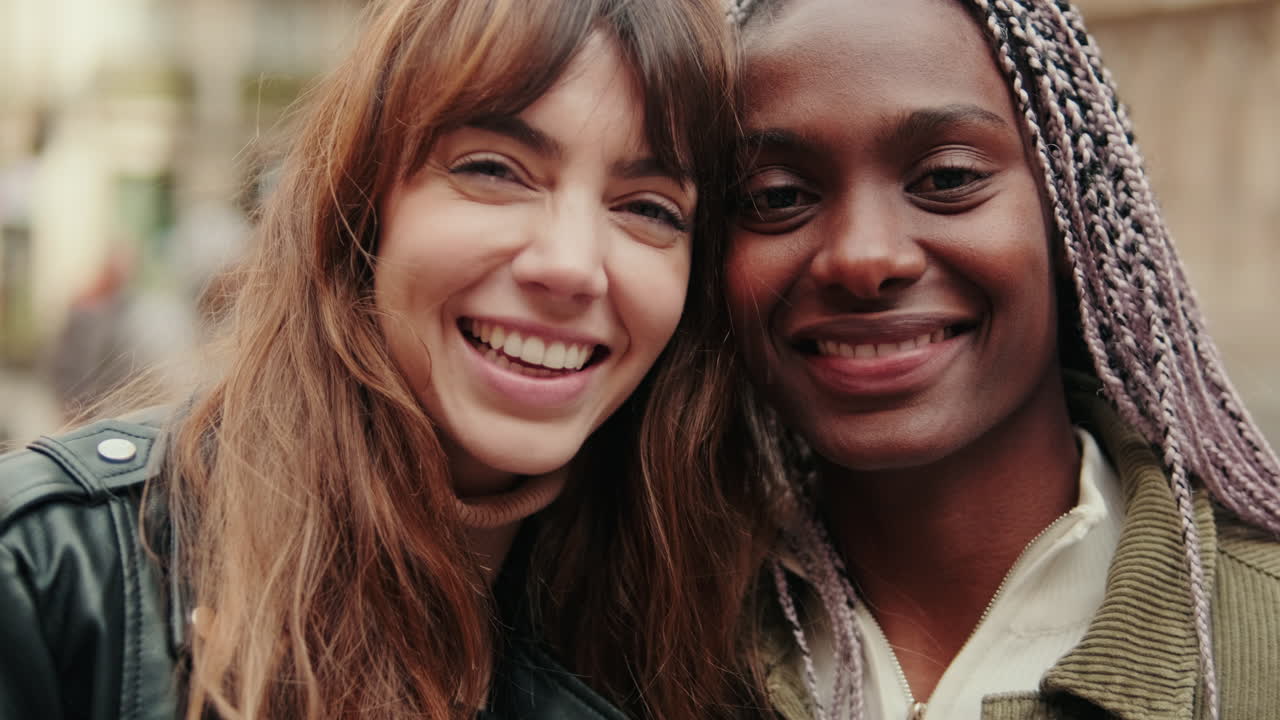 Portrait of Two Happy Diverse Women Smiling and Laughing