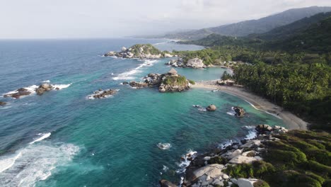 aerial orbiting view of famous cabo san juan beach bay in tayrona national natural park, colombia