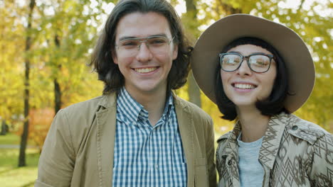 couple smiling in autumn park