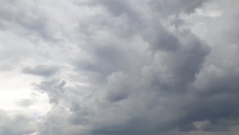 Mid-afternoon-thunderstorm-rain-clouds-forming-and-blending-across-the-african-horizon-time-lapse,-noise-free-4k-footage