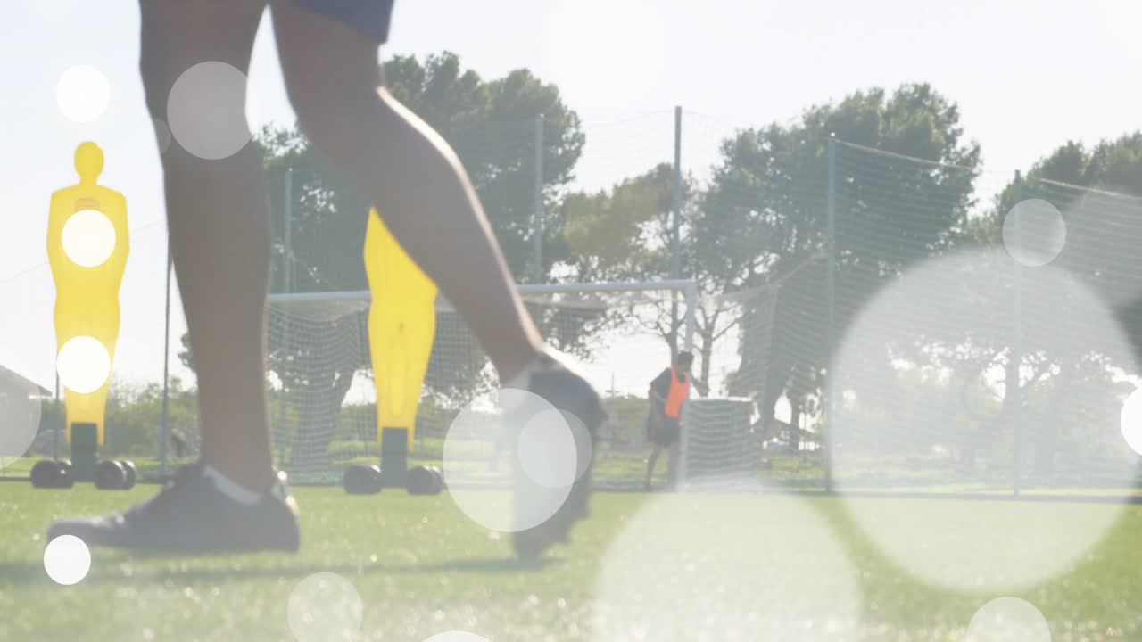 Soccer player approaching ball in training with animated path skimming past mannequins toward net