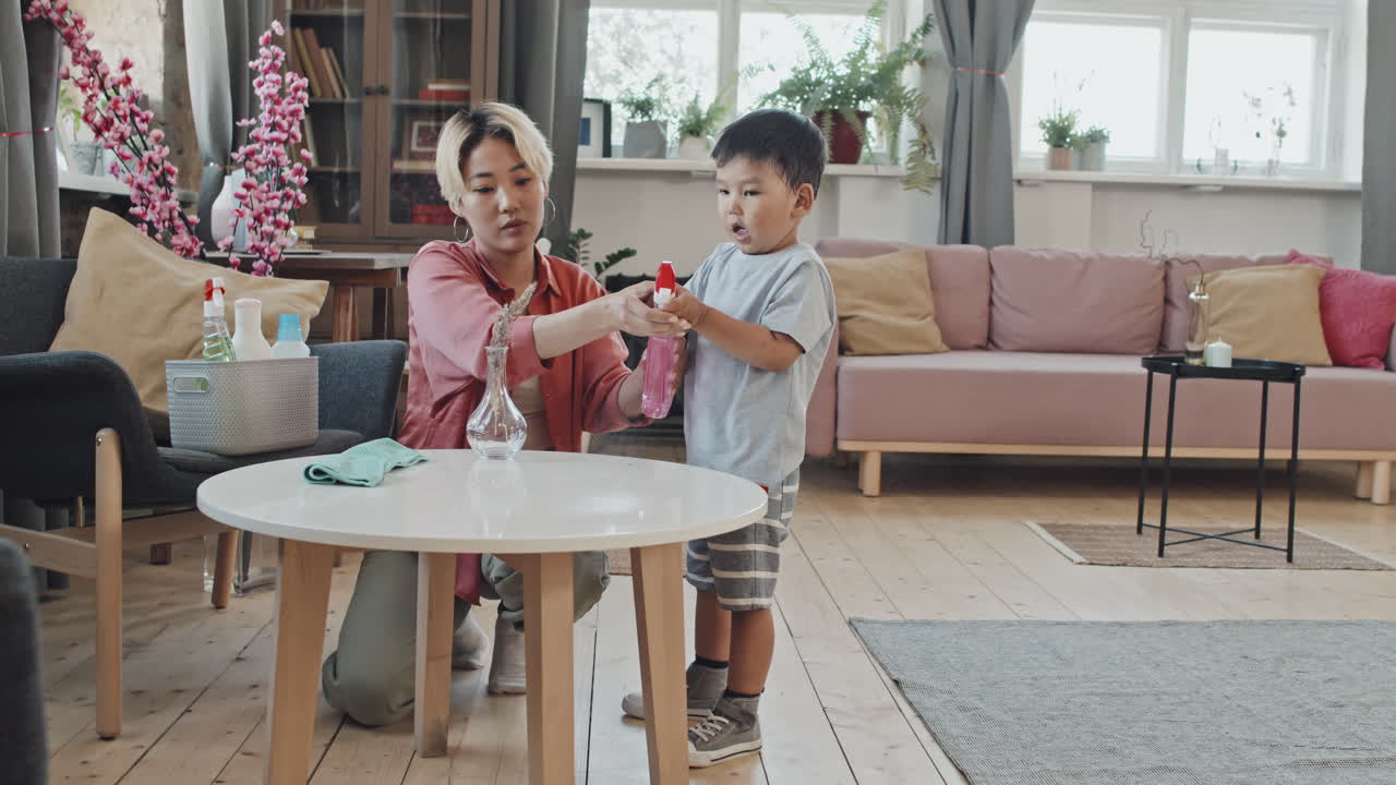 Asian Mom and Son Doing Household Chores Together