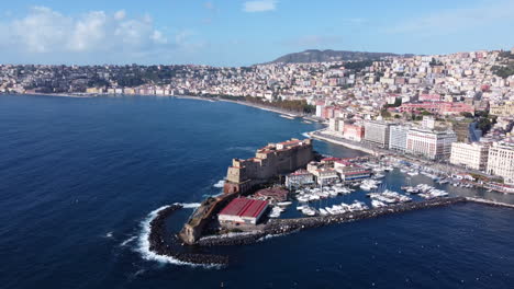 Aerial-View-Of-Ovo-Castle-With-A-Marina-In-Naples,-Italy