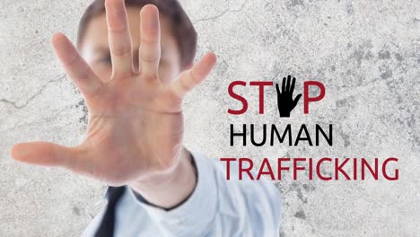 animation of stop human trafficking text over caucasian man with stop gesture