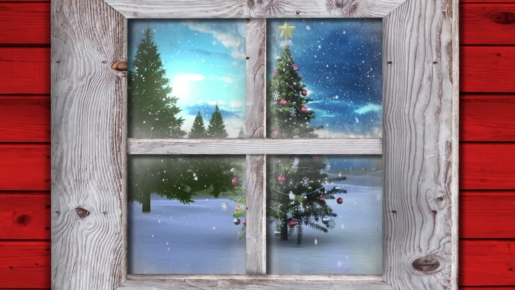 Wooden window frame against snow falling over christmas tree on winter landscape