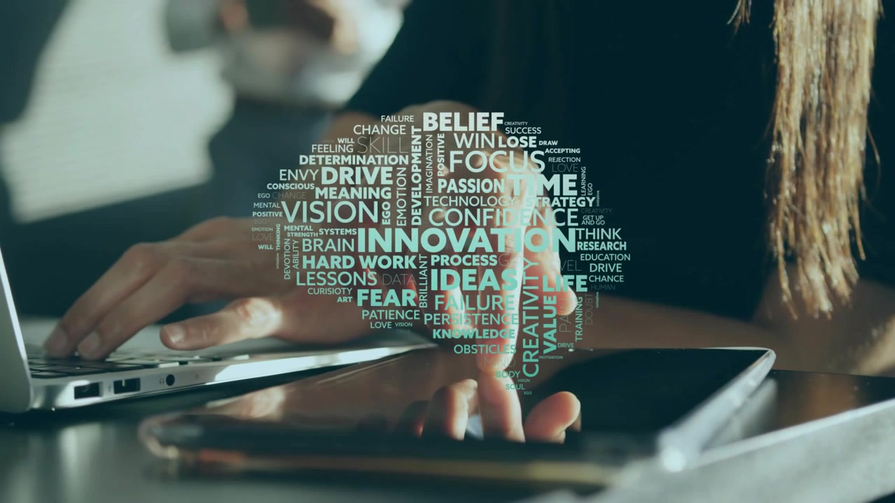 Mid-adult woman tapping tablet then typing laptop, word-cloud over devices, showing innovation
