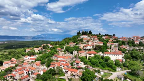 the medieval village of hvar port and resort town in croatia. aerial drone shot