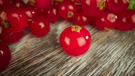 Super-close-macro-of-a-redcurrants-on-a-wooden-table.