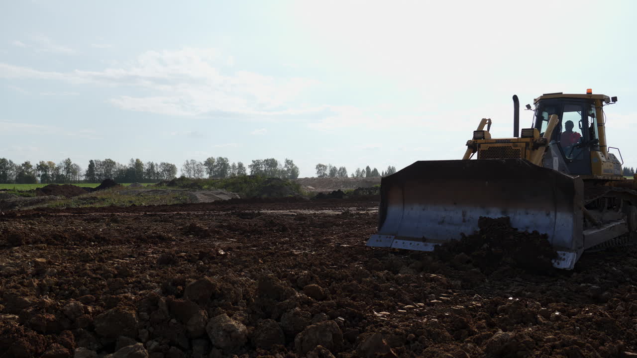 Bulldozer on a Construction Site Moving Earth