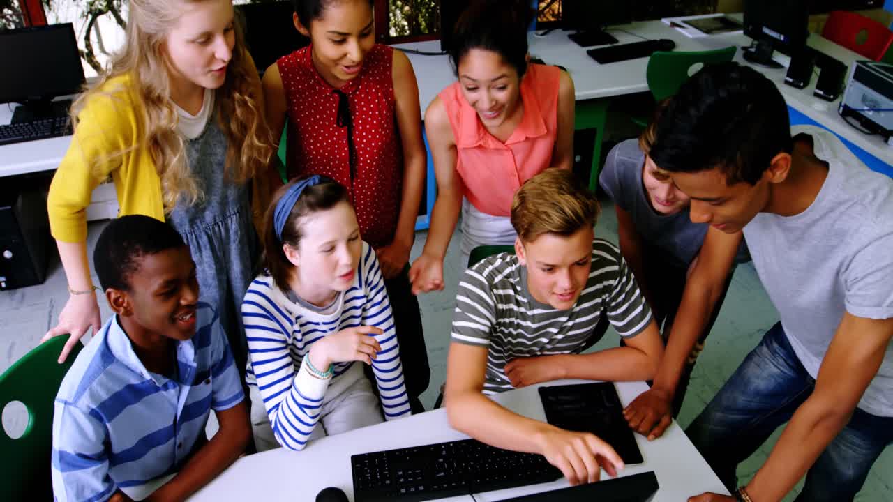 Group of students studying on computer